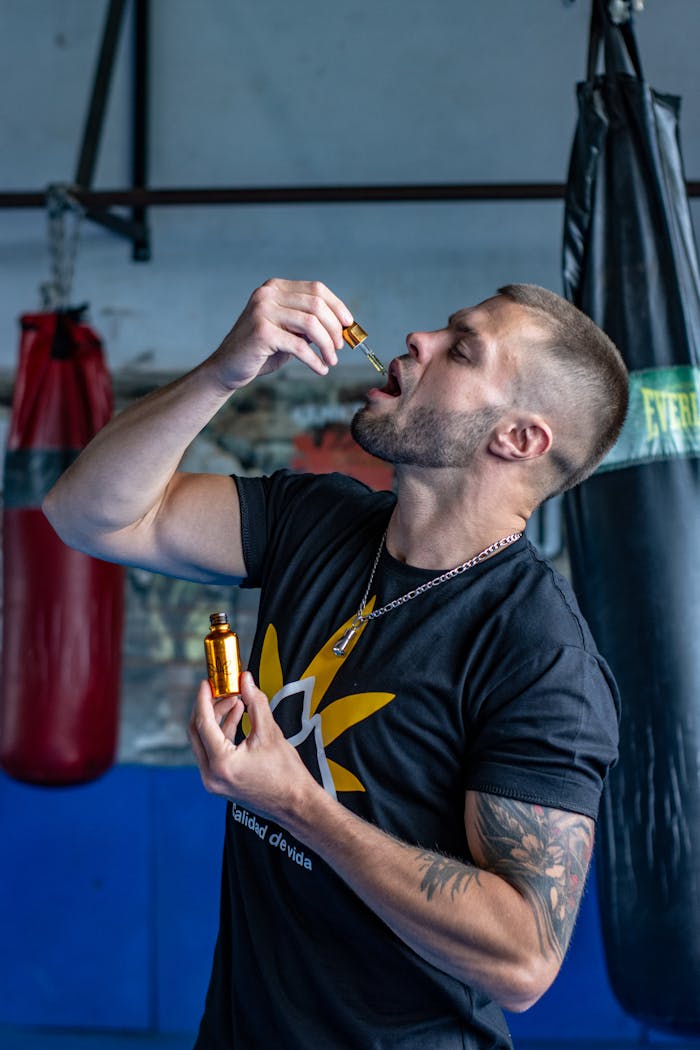 Boxer Drinking Dietary Supplements at the Gym